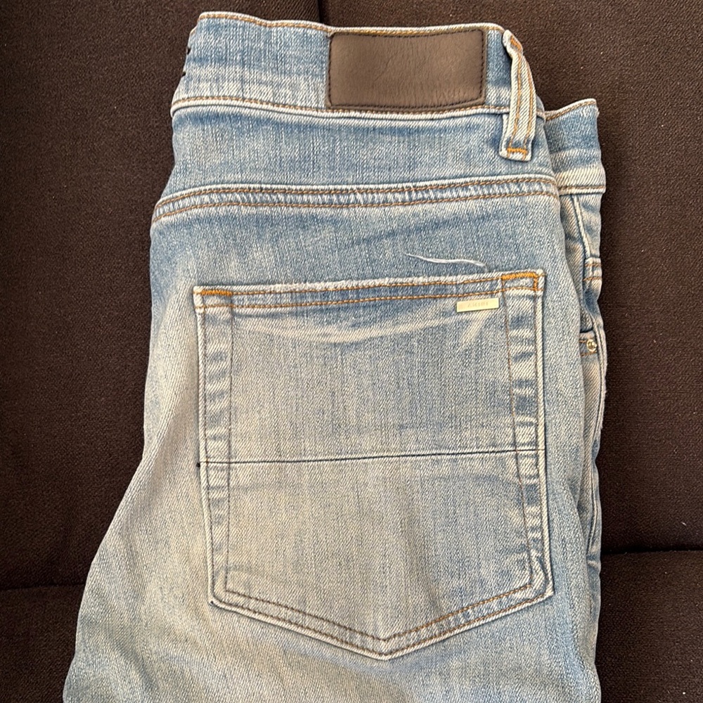 Distressed Light Blue Jeans With Patch - image 3